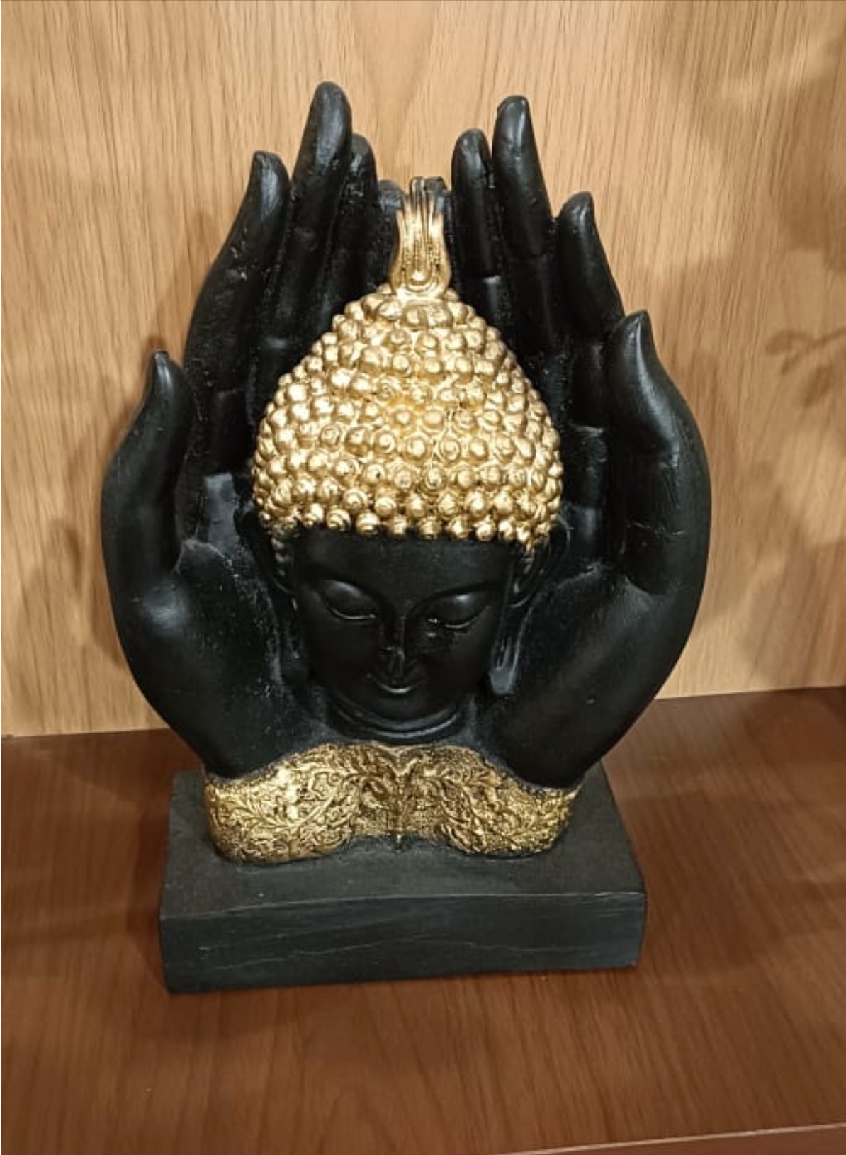 Beautiful Matte Black buddha face in hands statue (small)